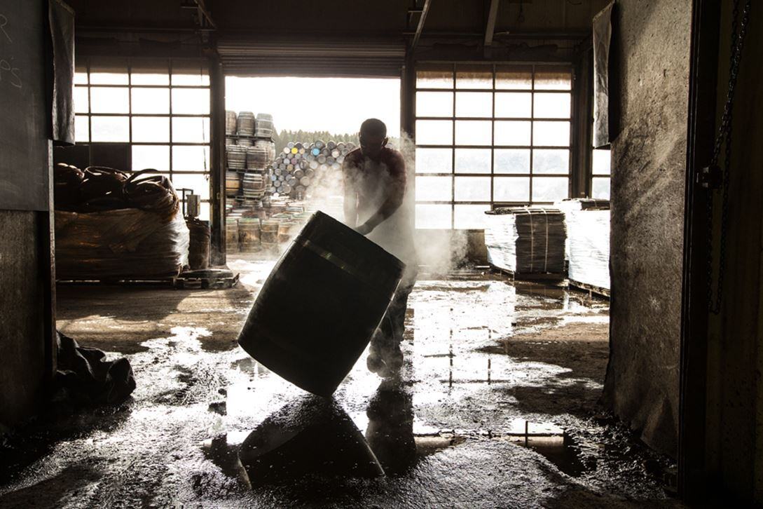 A cooper working on a Gordon and MacPhail whisky cask in a cooperage